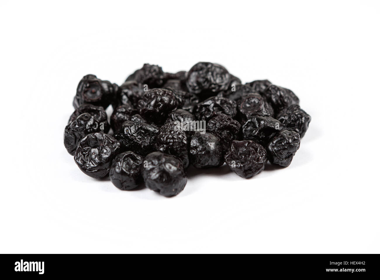 Dried blueberries isolated on white background Stock Photo - Alamy