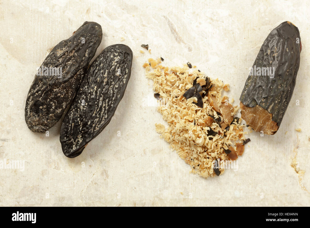 Tonka beans – whole and grated Stock Photo