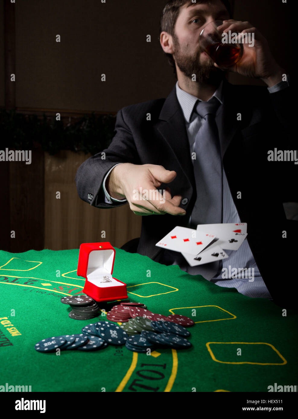 Gambling Addiction Man In A Business Suit Drinking Brandy And Throws Cards With Losing Combination Casino Chips Precious Ring On Green Poker Table Stock Photo Alamy