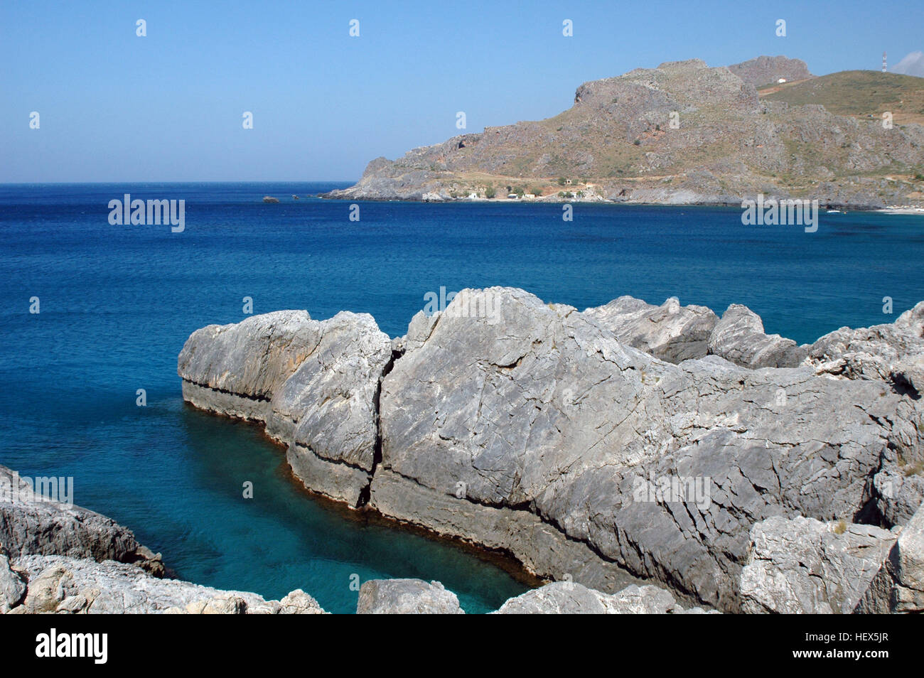 Uplifted coastal abrasion notch from the AD 365  Mediterranean earthquake, preserved on a limestone headland protruding into Damnoni Bay, Crete Greece Stock Photo