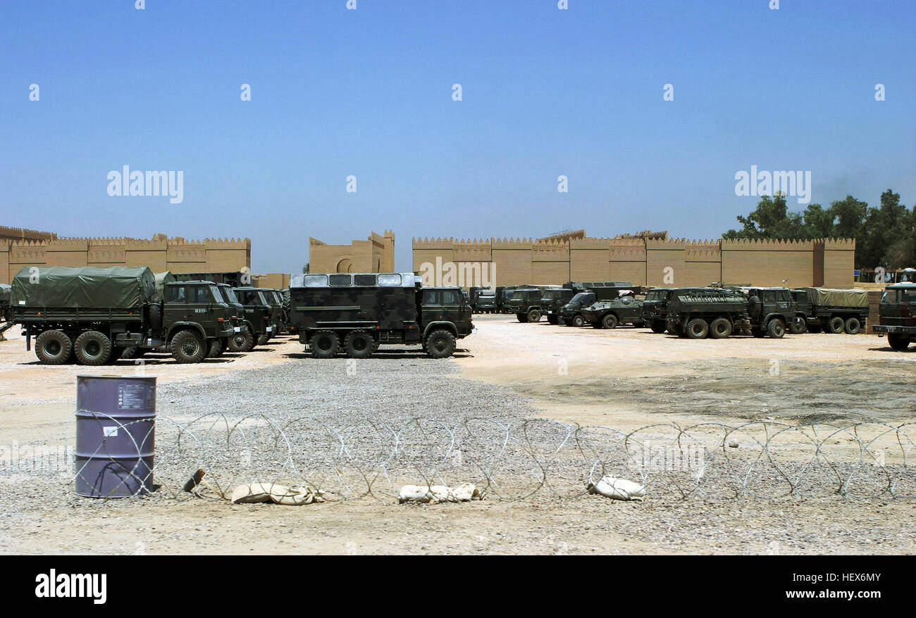 Polish Armed Forces Star Series 266 (6x6) 3,500 kg cargo trucks and other military vehicles parked outside the walls of the ancient ruins of Babylon at Camp Babylon, Iraq, during Operation IRAQI FREEDOM. Polish Armed Forces at Camp Babylon, Iraq Stock Photo