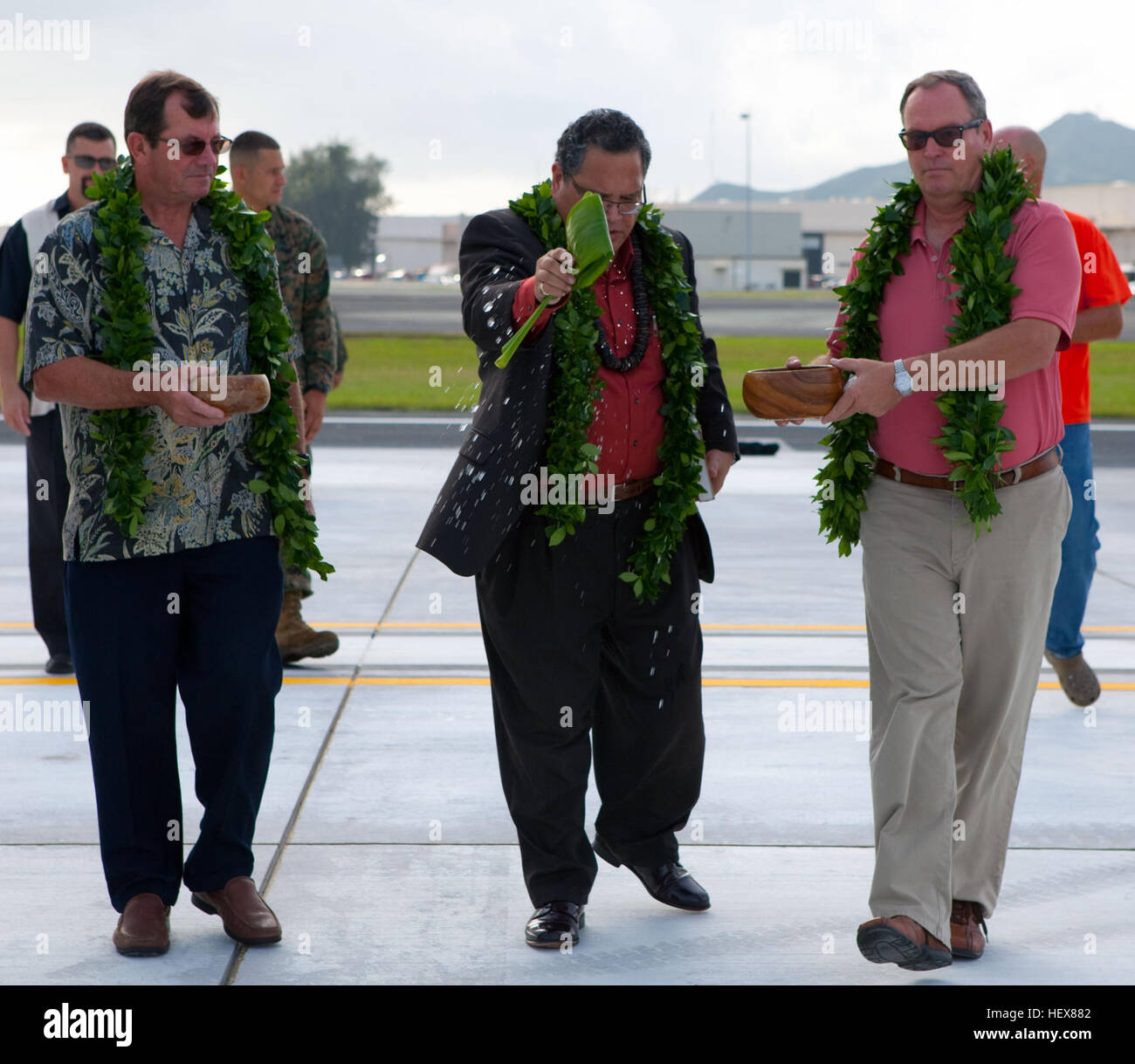 Pastor Kelekona Bishaw of Real Life Christian Center blesses the completed construction on Marine Corps Air Station Kaneohe Bay’s Feb. 15. The runway on Maj. Gen. Marion Eugene Carl Field reopened after two months of construction. MCAS runway reopens DVIDS367709 Stock Photo