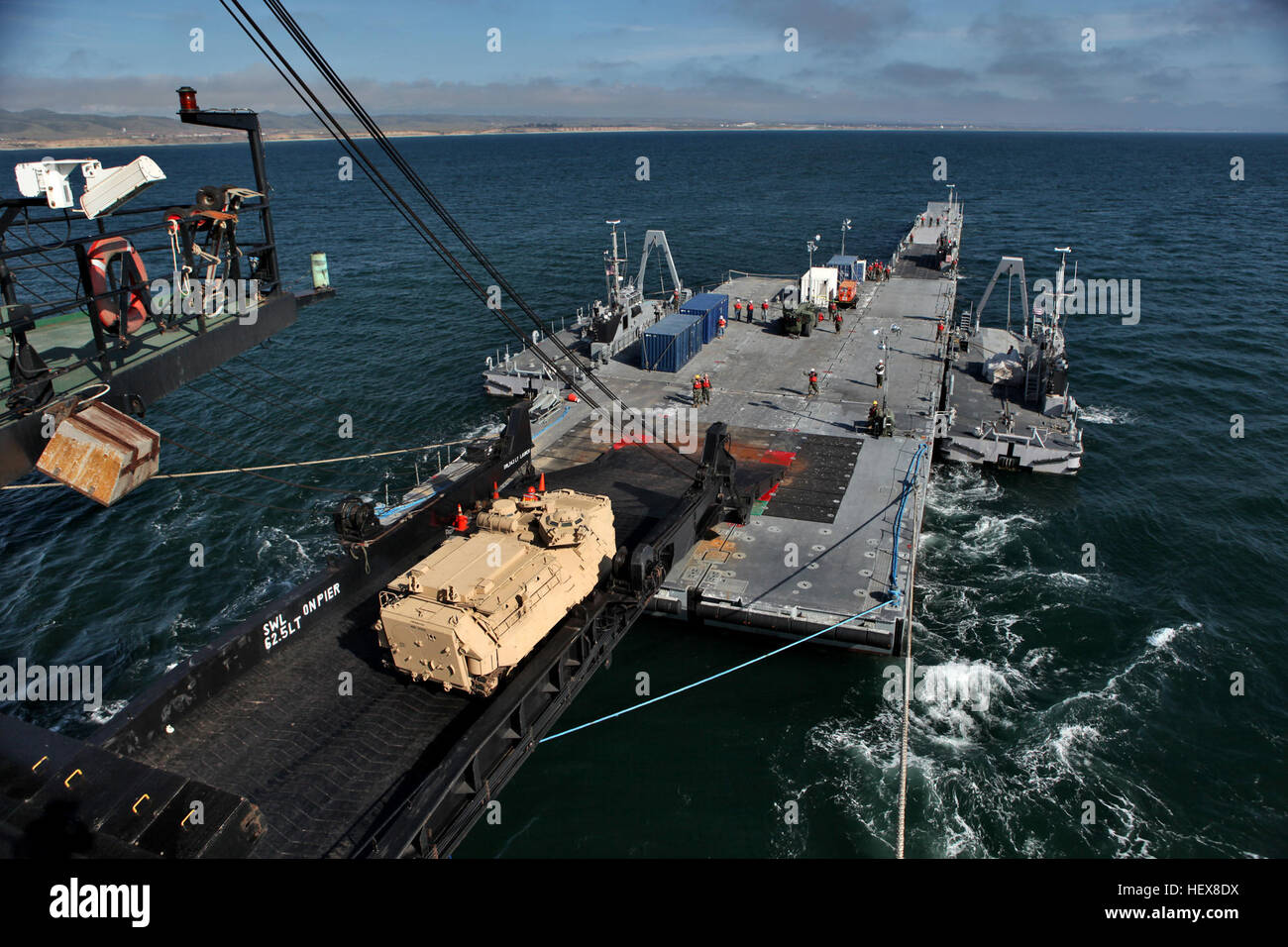 A 3rd Amphibious Assault Battalion vehicle loads onto USNS Sgt. William ...