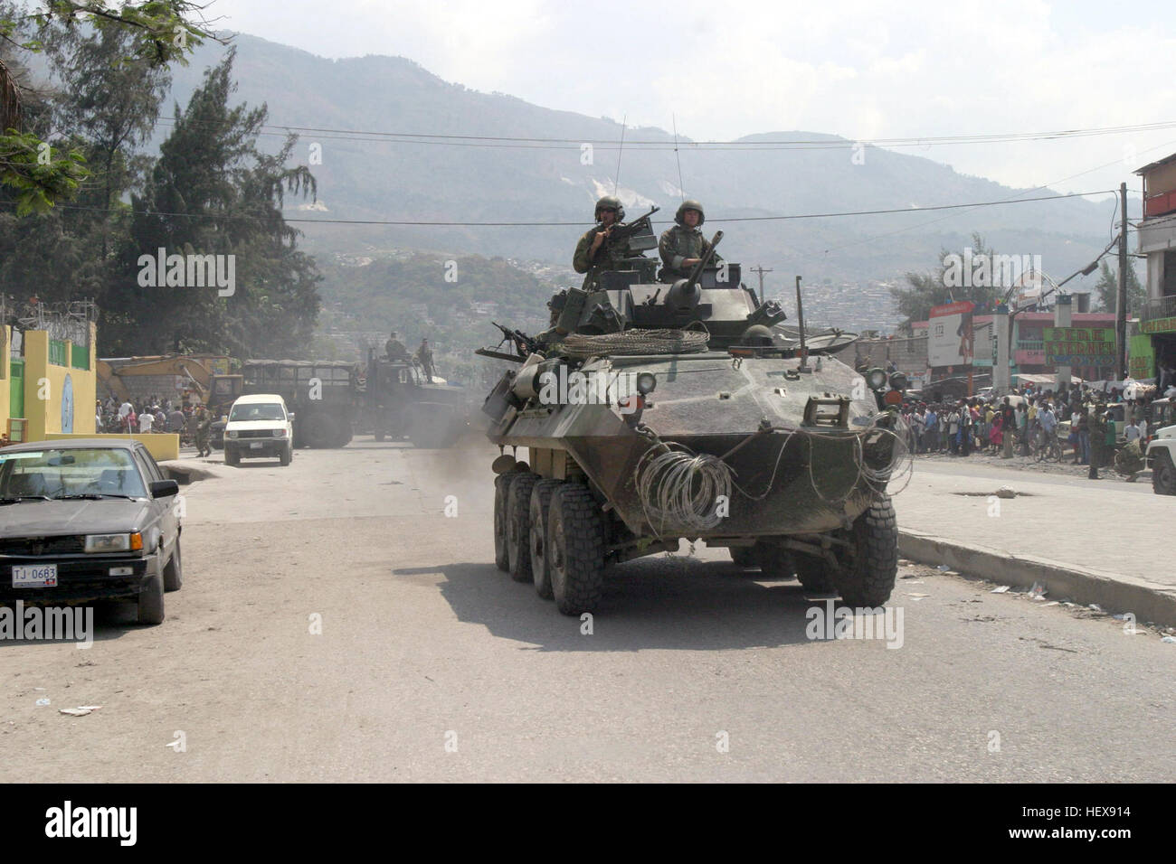 040405-M-8172E-098 Port-Au Prince, Haiti (Apr. 5, 2004) - An Light Armored Vehicle (LAV) assigned to 2nd LAR BN passes by a local AIDS clinic in Port-Au Prince, the capital city of Haiti. U.S. Marine Corps photo by Cpl Eric Ely. (RELEASED) US Navy 040405-M-8172E-098 An Light Armored Vehicle (LAV) assigned to 2nd LAR BN passes by a local AIDS clinic in Port-Au Prince, the capital city of Haiti Stock Photo