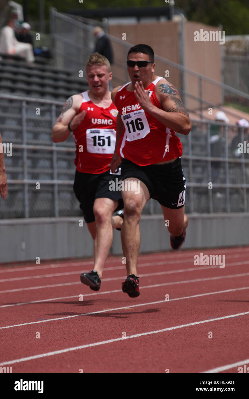 U.S. Marine Cpl. Thomas Whiteway (left) from Colorado Springs, Colo. and Sgt Jose Gonzales fron San Antonio, Texas race down the track  at the 2011 Warrior Games at the Garry Berry Stadium in Colorado Springs, Colo. May 17, 2011. U.S. Army, Marine Corps, Navy and Coast Guard, Airforce and Special Forces will compete agianst one another in various events over a period of five days. (U.S. Marine Corps photo by Lance Cpl Kayla M. Hemann) Marine team dominates track and field competition at 2011 Warrior Games 110517-M-KP294-448 Stock Photo