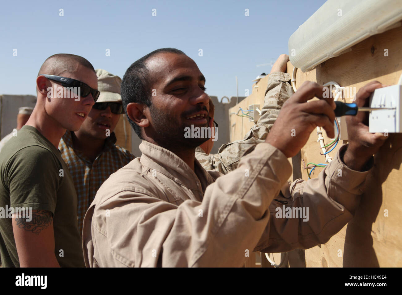 Noor Mohammad Armani an Afghan Border Police officer installs an