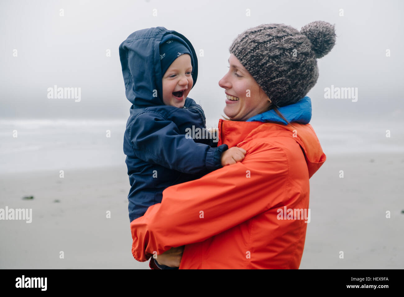 Portrait of mother holding son, smiling, Long Beach, Vancouver Island, British Columbia, Canada Stock Photo