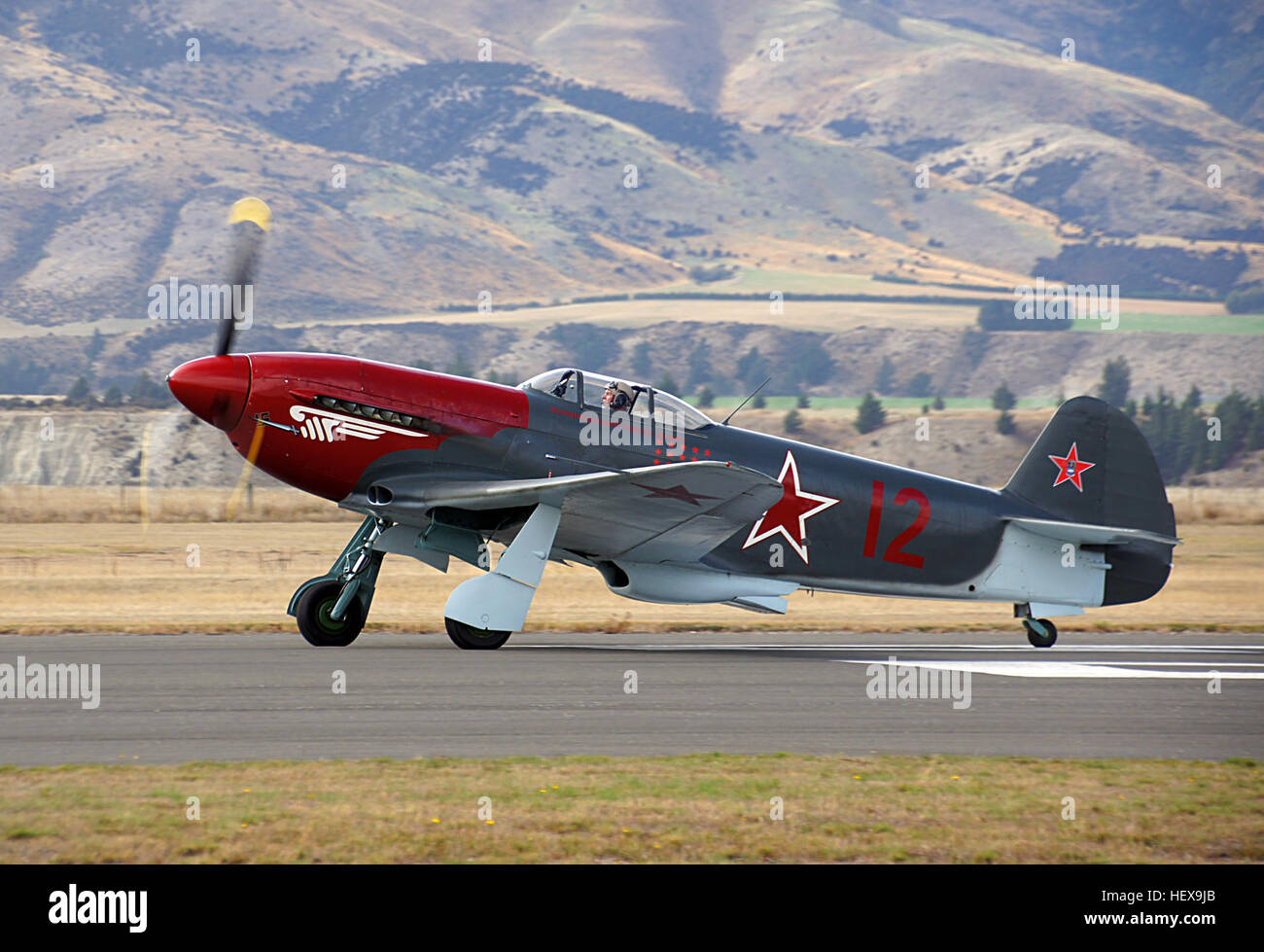 The Yak 3 was regarded as one of the finest interceptors of WWII and was nicknamed &quot;Dogfighter Supreme.&quot; Luftwaffe pilots became accustomed to shooting down poorly equiped, hastily trained Russians.   The Yak-3 entered service in 1944, constructed in plywood instead of fabric covering the rear fuselage, mastless radio antenna, reflector gunsight and improved armor and engine cooling. Armed with a single 20 mm ShVAK cannon and one 12.7 mm UBS machine gun, it was  a forgiving, easy-to-handle aircraft loved by both rookie and veteran pilots and ground crew as well. It was robust, easy t Stock Photo