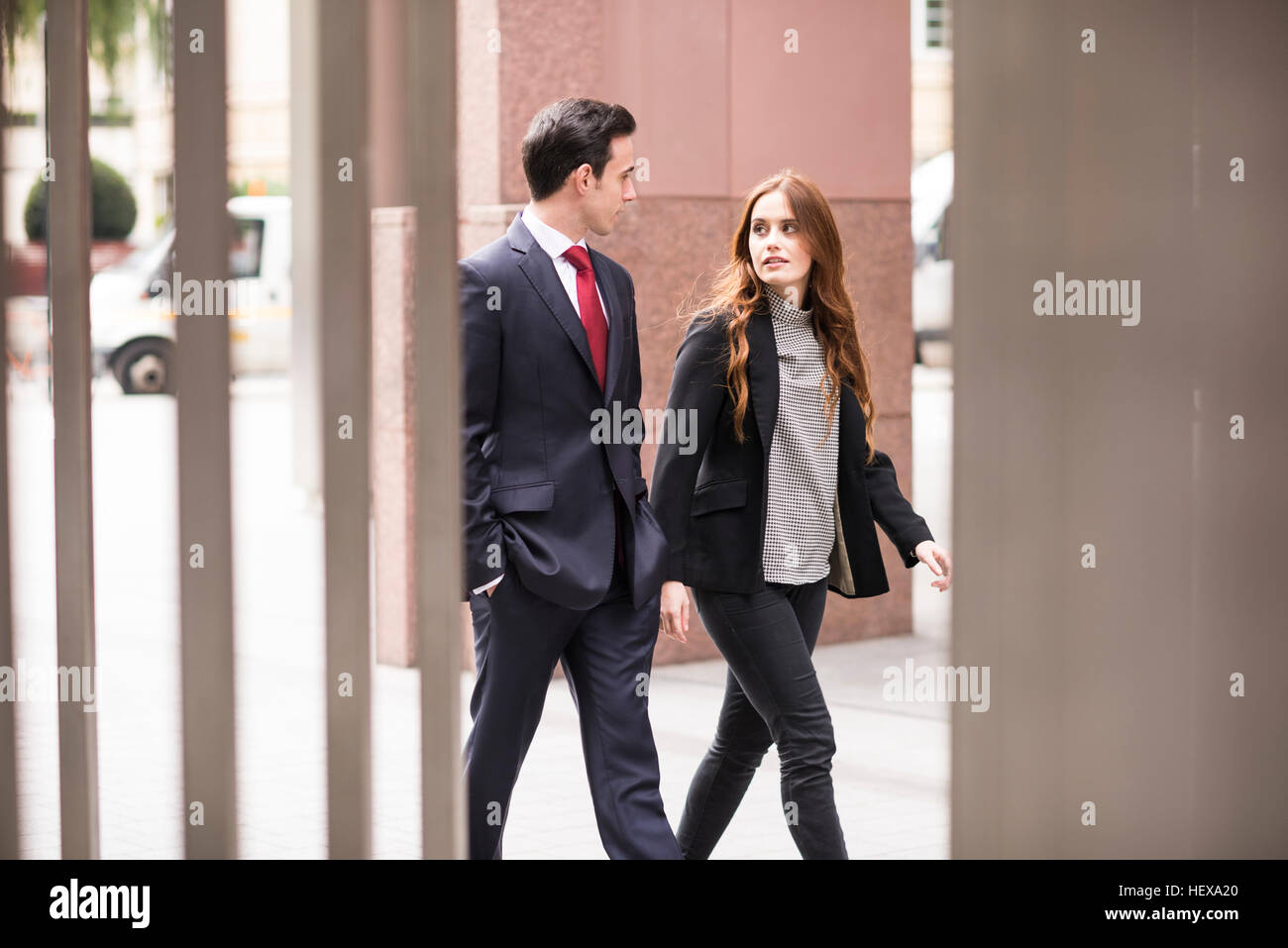 Business people walking in city talking Stock Photo - Alamy