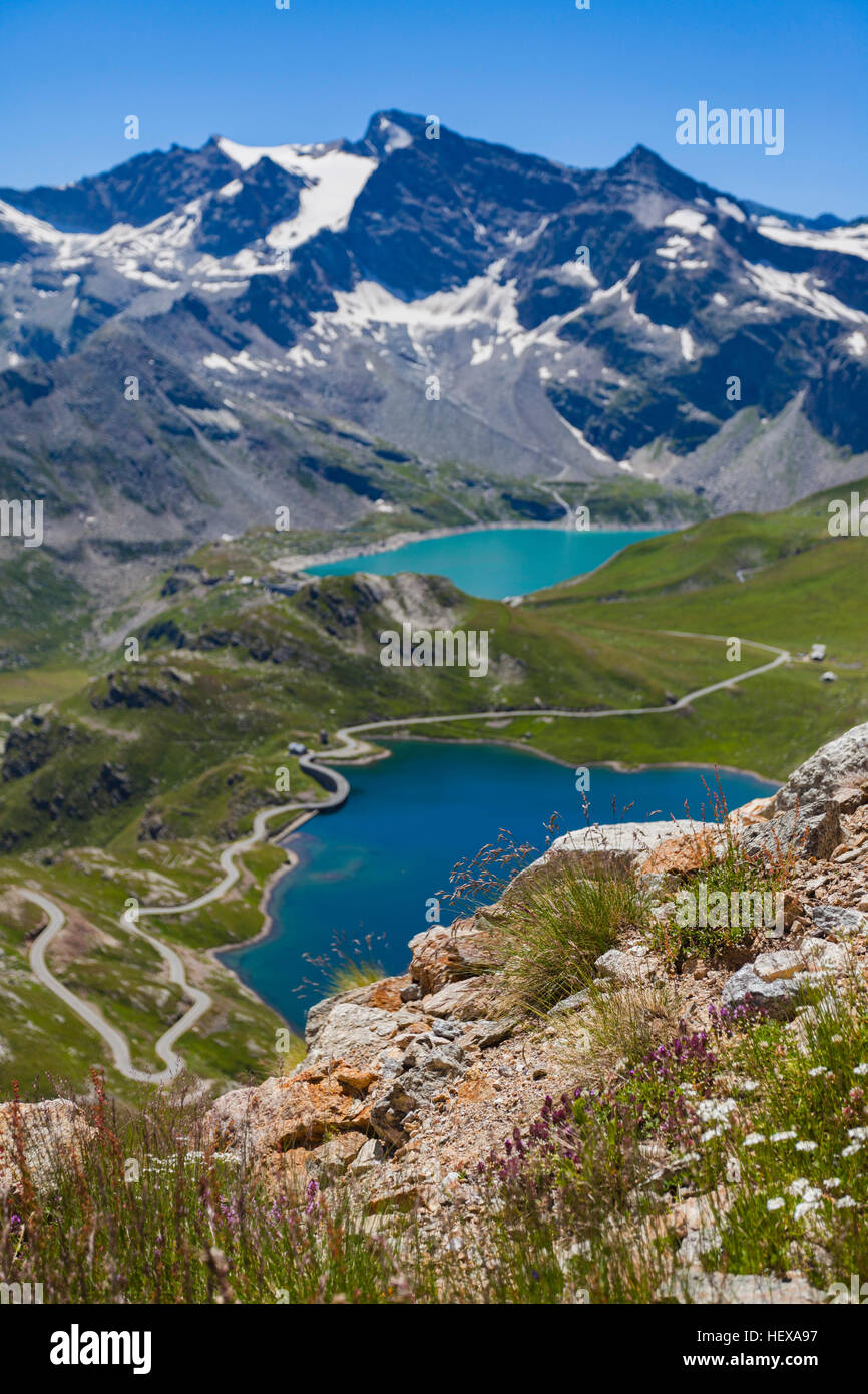 Scenic view of alps and lake, Colle del Nivolet, Piedmont, Italy Stock Photo