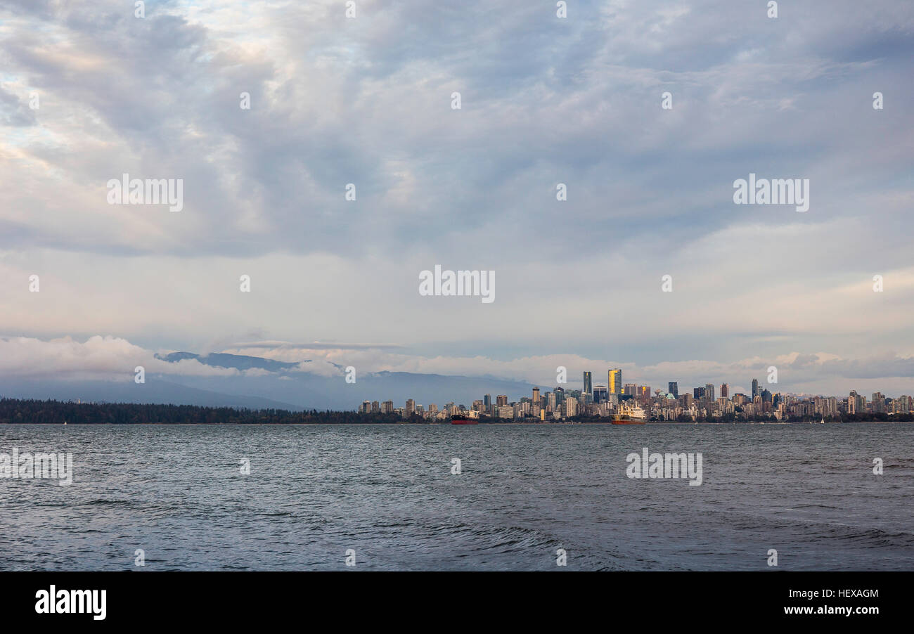 Distant view of city skyline over Vancouver harbour, Vancouver, Canada Stock Photo