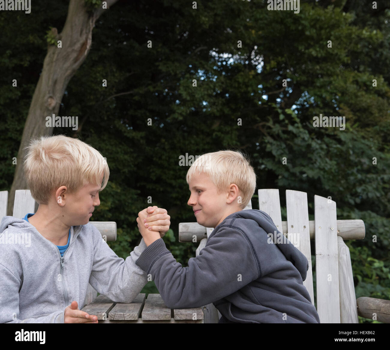 Boys arm wrestling Stock Photo