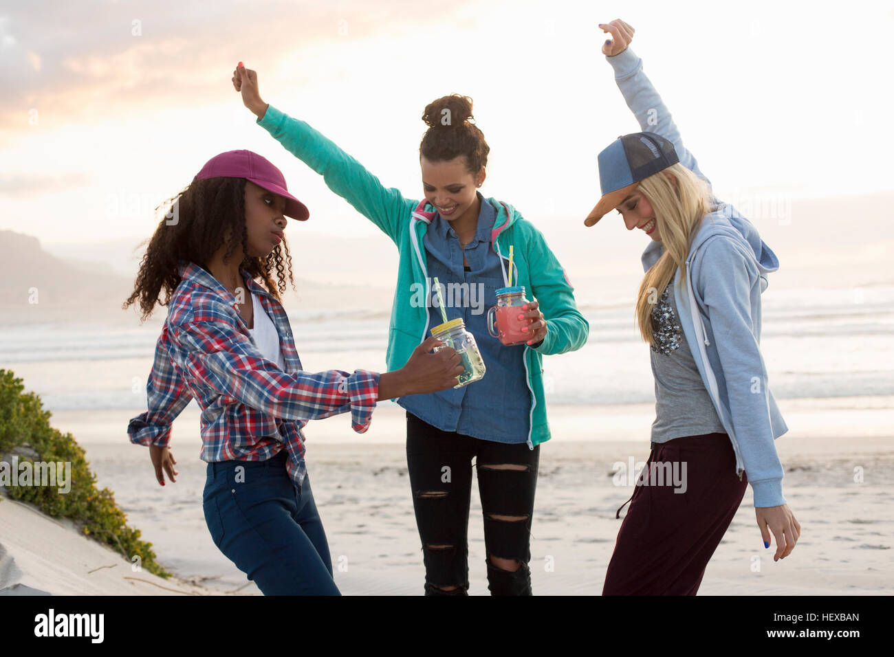 Woman dancing beach jeans hi-res stock photography and images - Alamy