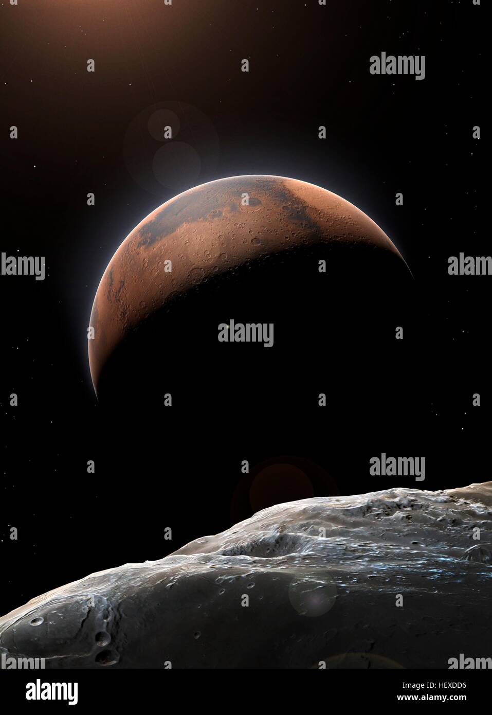 An impression of the Red Planet, Mars, the second smallest planet in the Solar System (after Mercury). Its outermost moon, Deimos, is seen in the foreground. Stock Photo