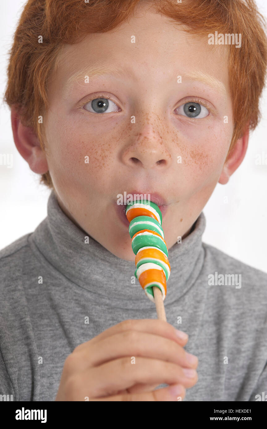 model-released-portrait-of-a-boy-sucking-lollipop-stock-photo-alamy