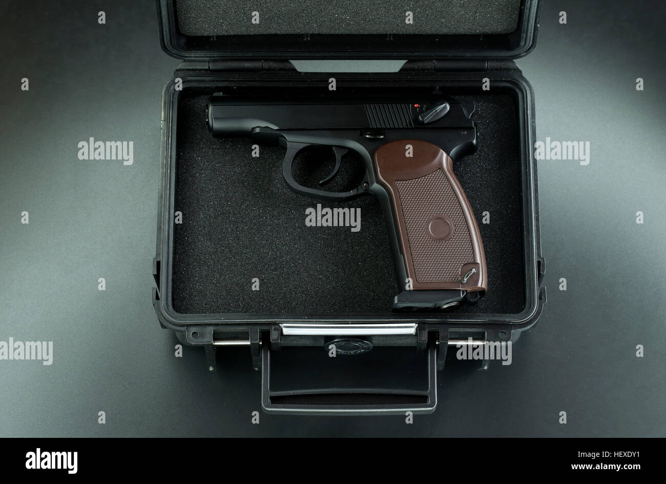 Handgun in a briefcase Stock Photo Alamy