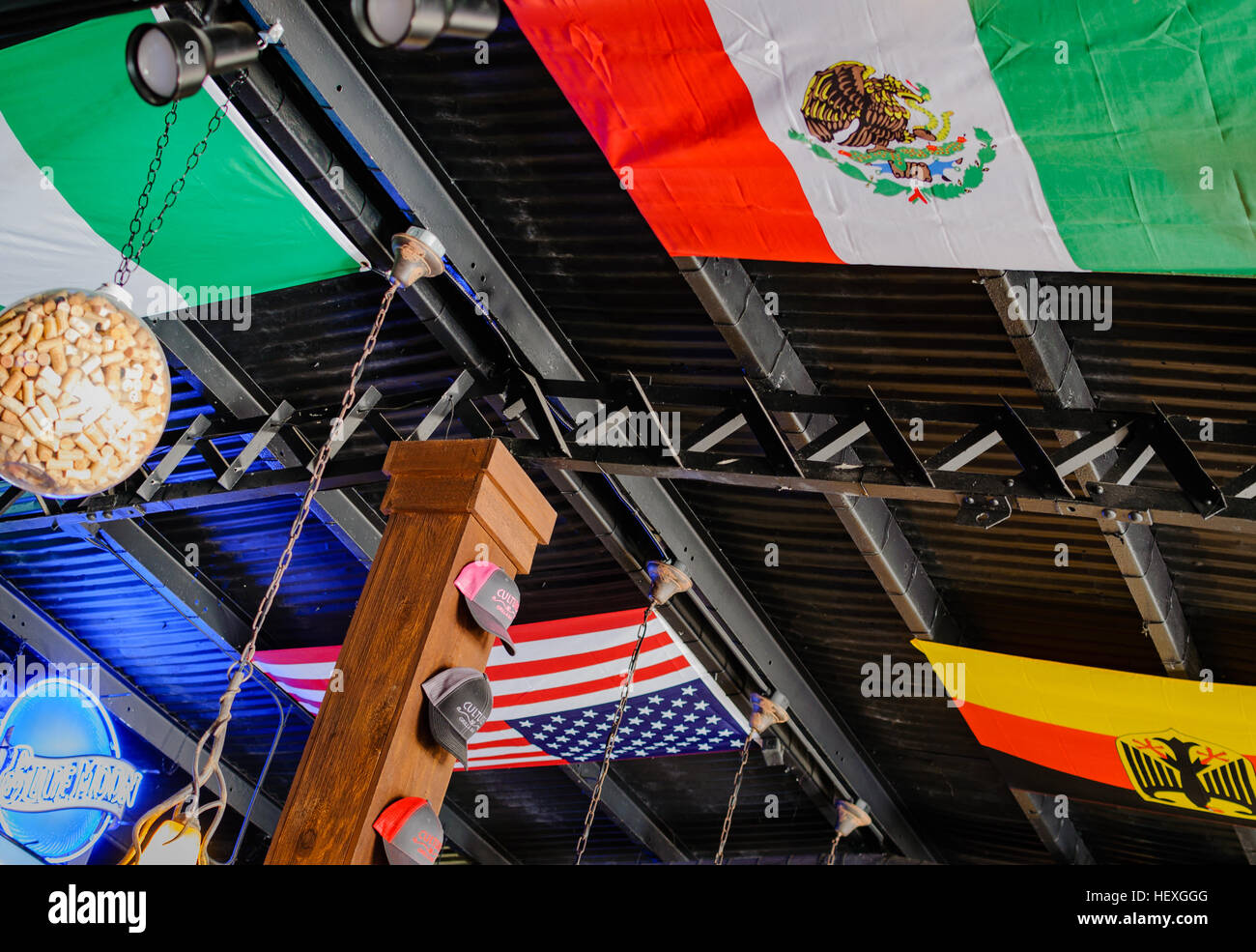 Mexican, German, and American flags displayed on the ceiling of the Culture's Grill cafe, Fredericksburg, Texas, USA Stock Photo