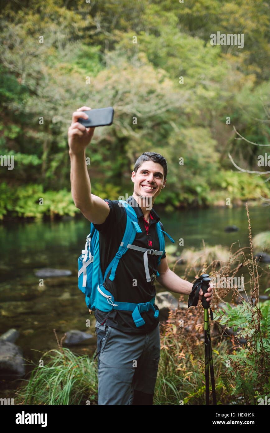 Hiker taking a selfie in nature Stock Photo