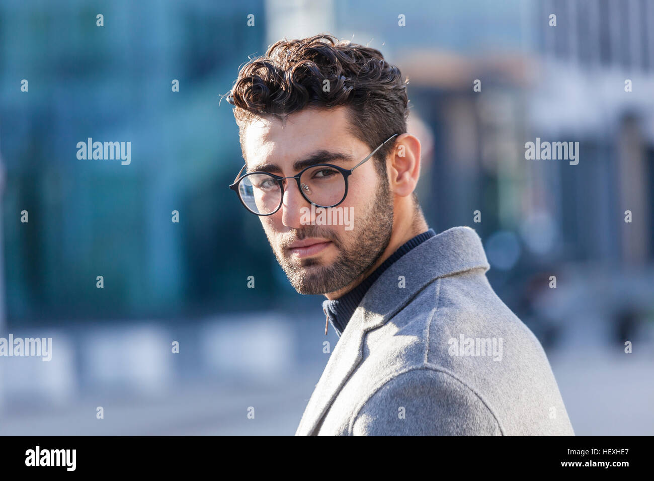 Portrait of young businessman with beard and spectacles Stock Photo