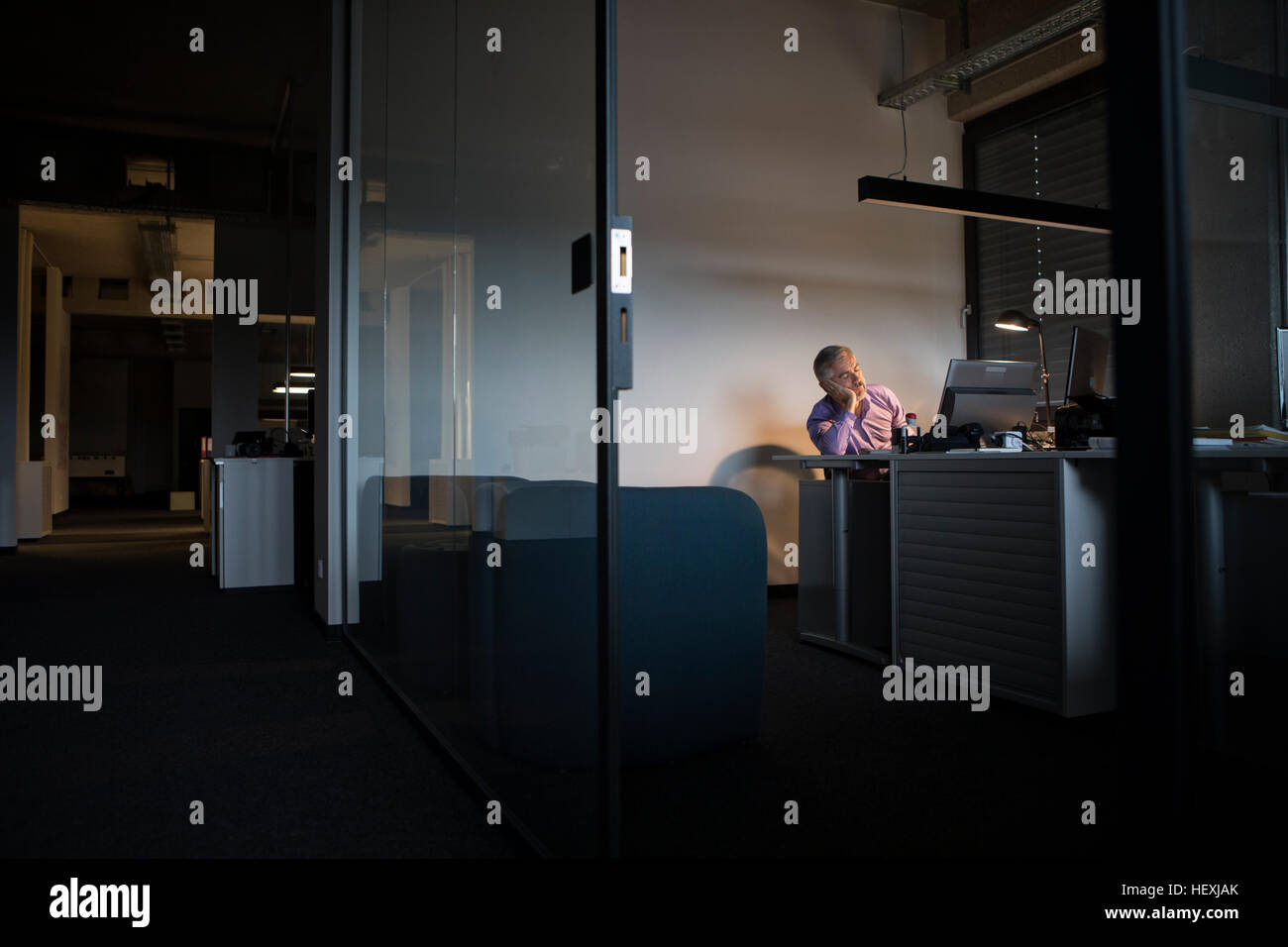 Exhausted businessman sleeping at office desk Stock Photo - Alamy