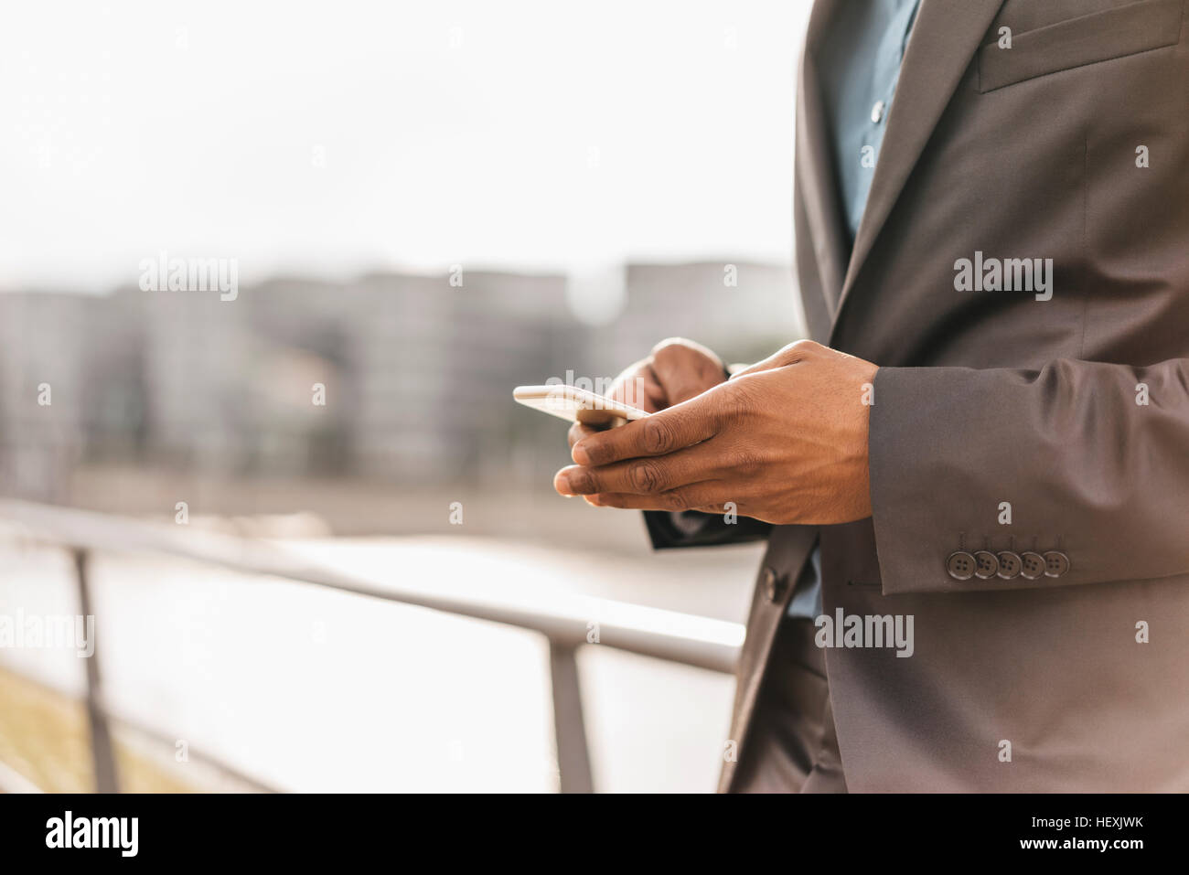 Young businessman using smart phone Stock Photo