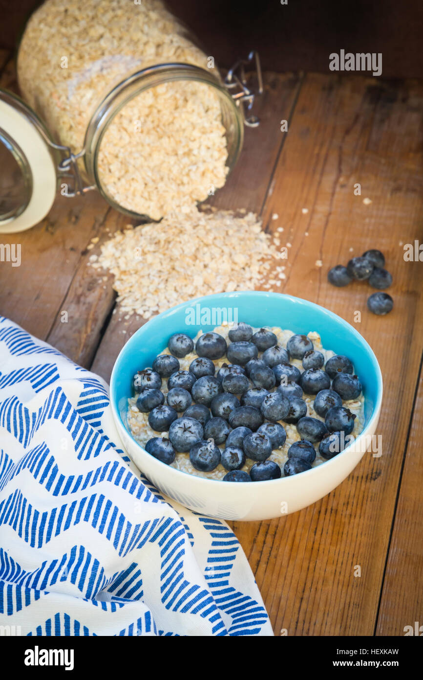 Bowl of overnight oats with blueberries on wood Stock Photo