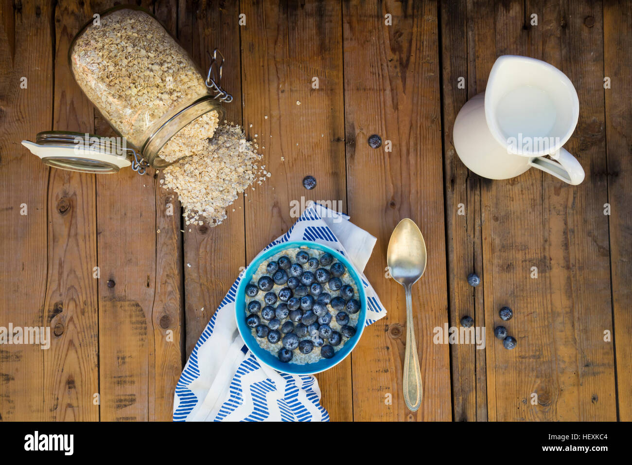 Bowl of overnight oats with blueberries on wood Stock Photo