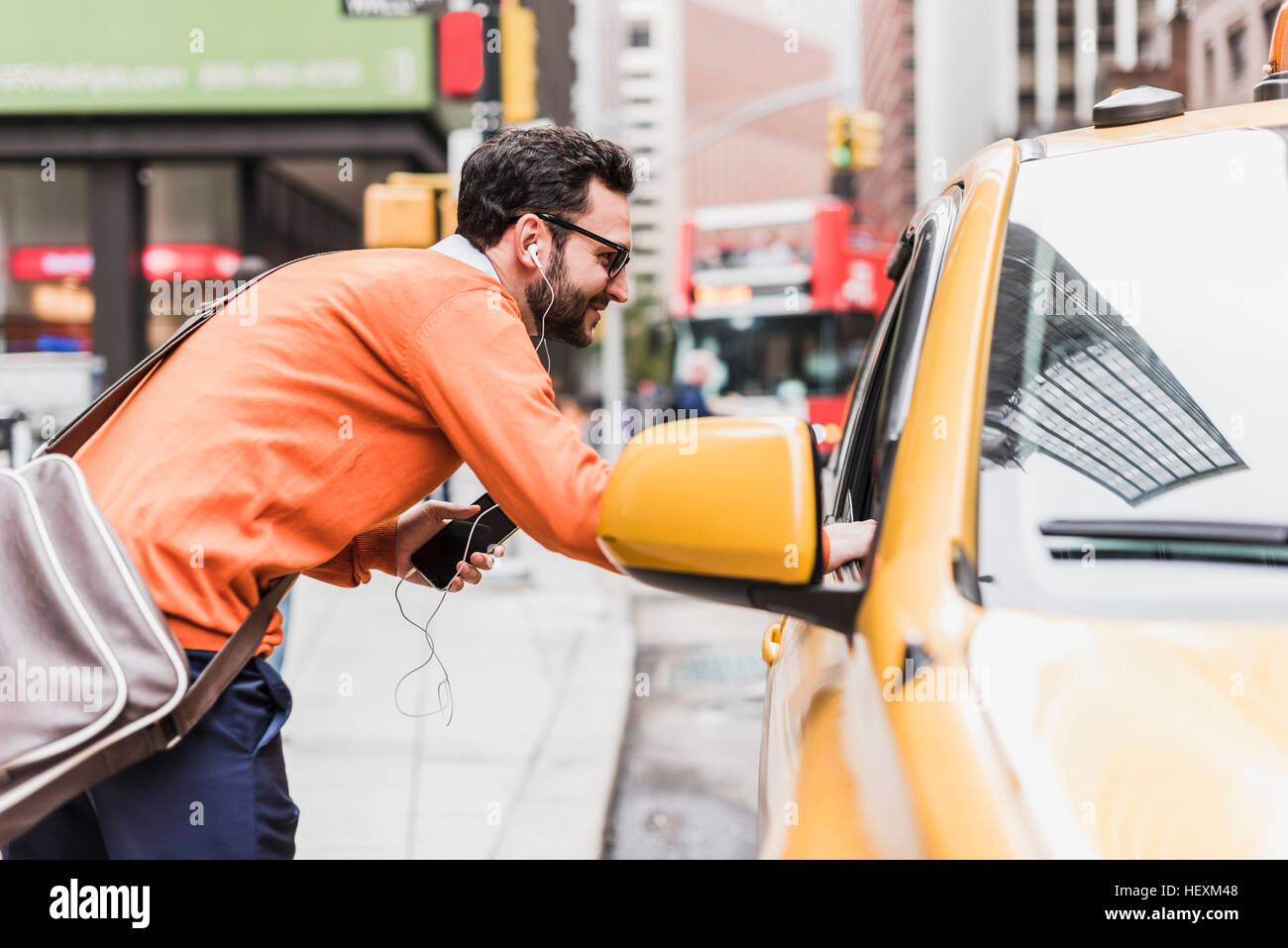 USA, New York City, Businessman talking to cab driver Stock Photo - Alamy