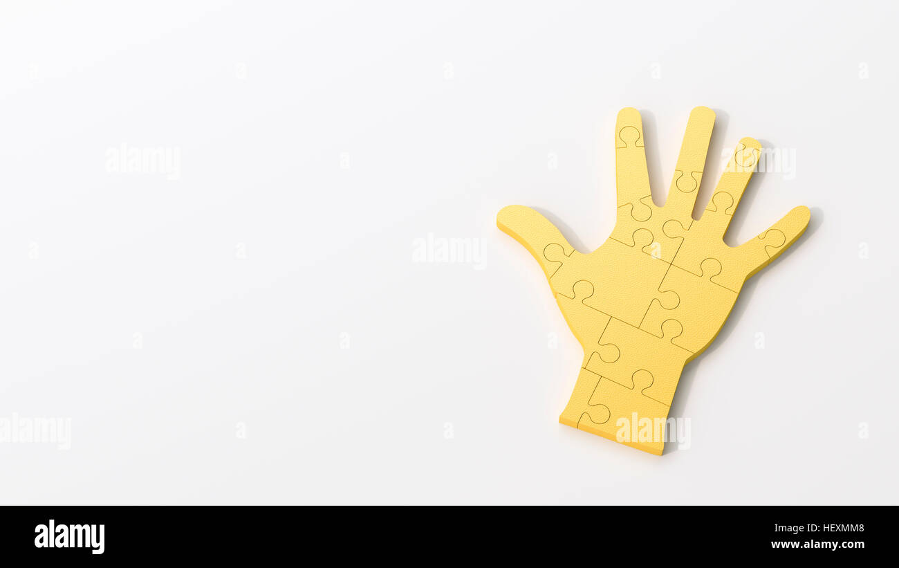 Yellow puzzle hand Stock Photo