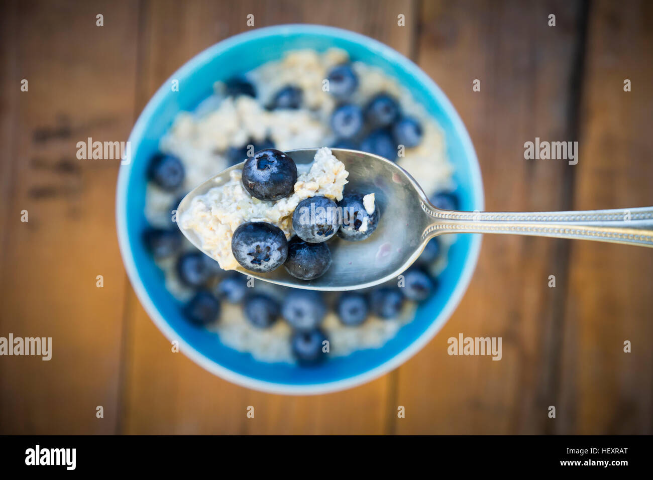 Spoon of overnight oats with blueberries, close-up Stock Photo