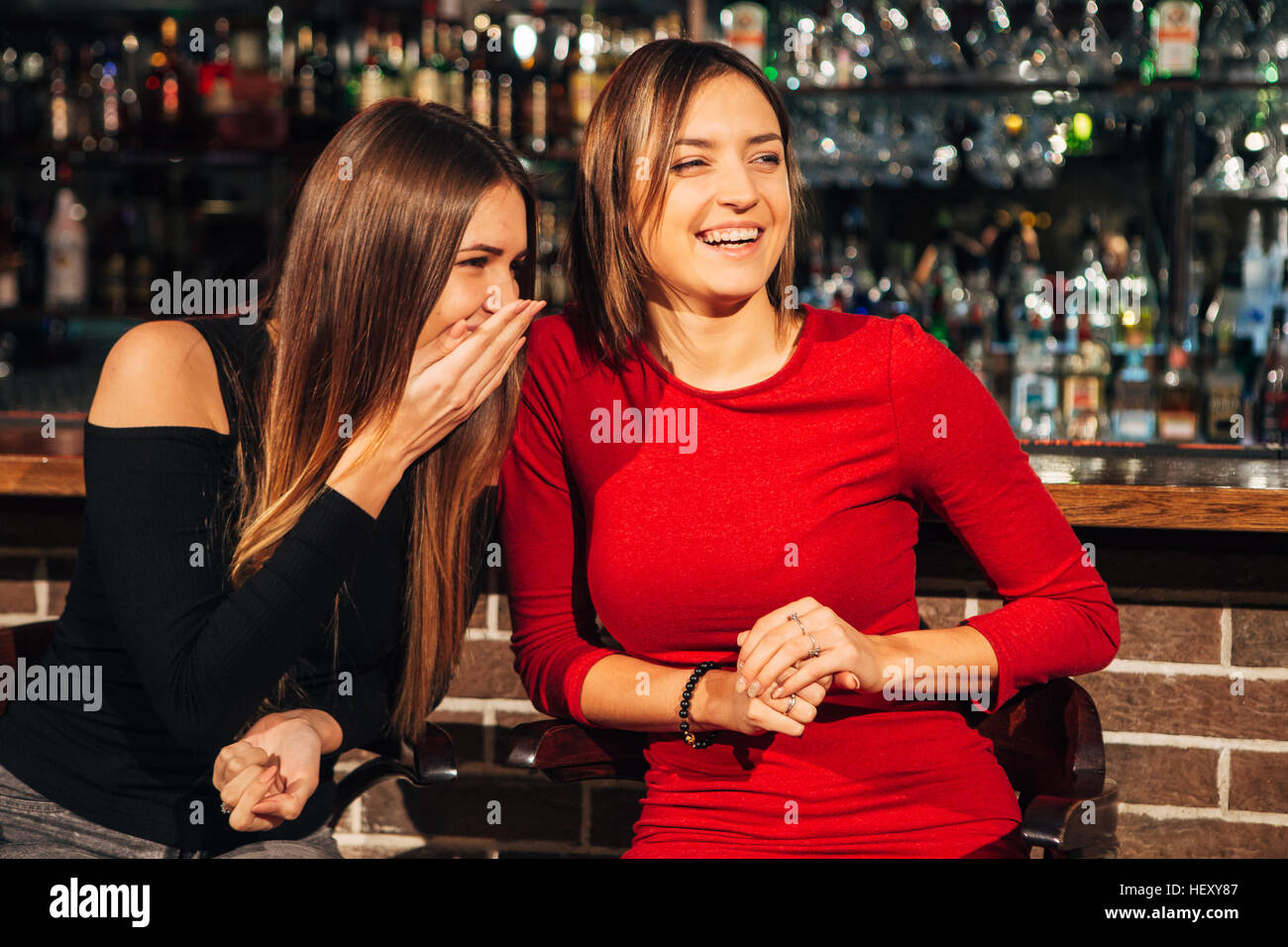 two women sitting at the bar,have fun smile Stock Photo Alamy