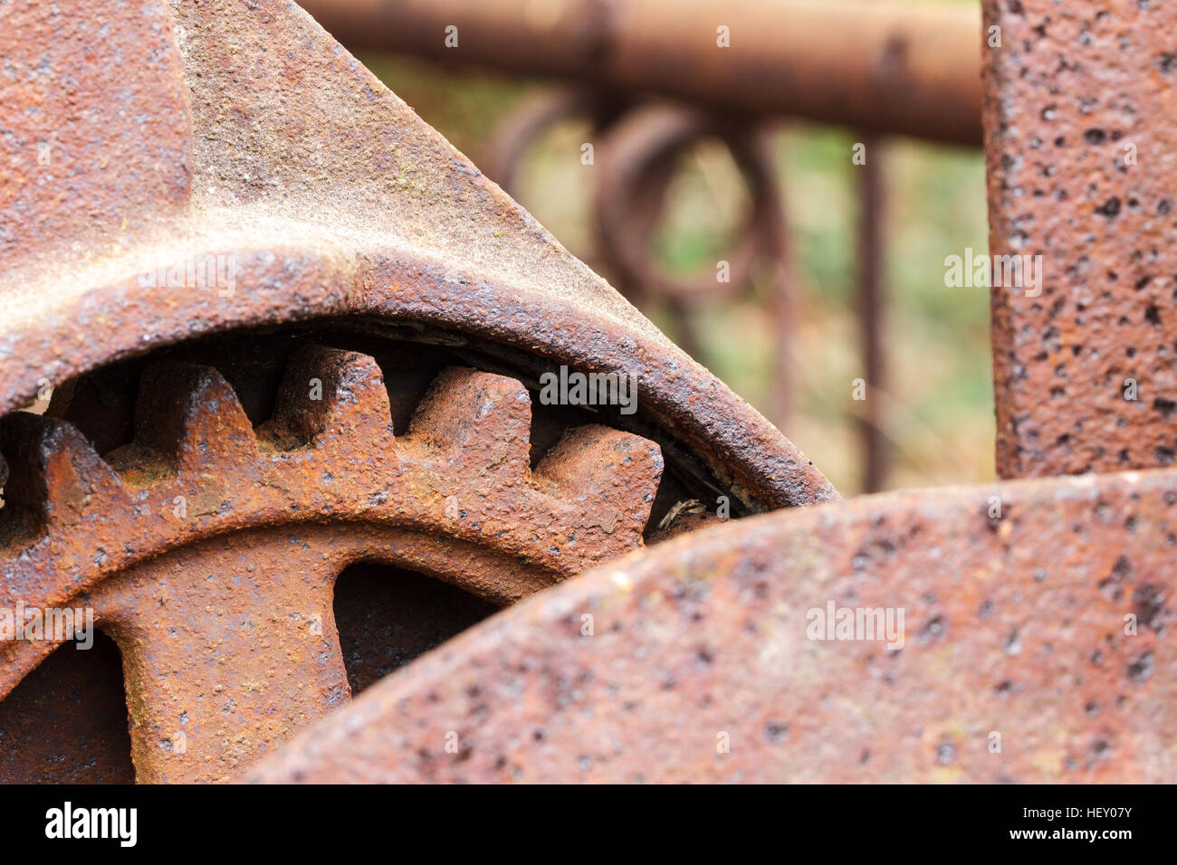 Close up of rusty gear on abandoned farm equipment. Stock Photo