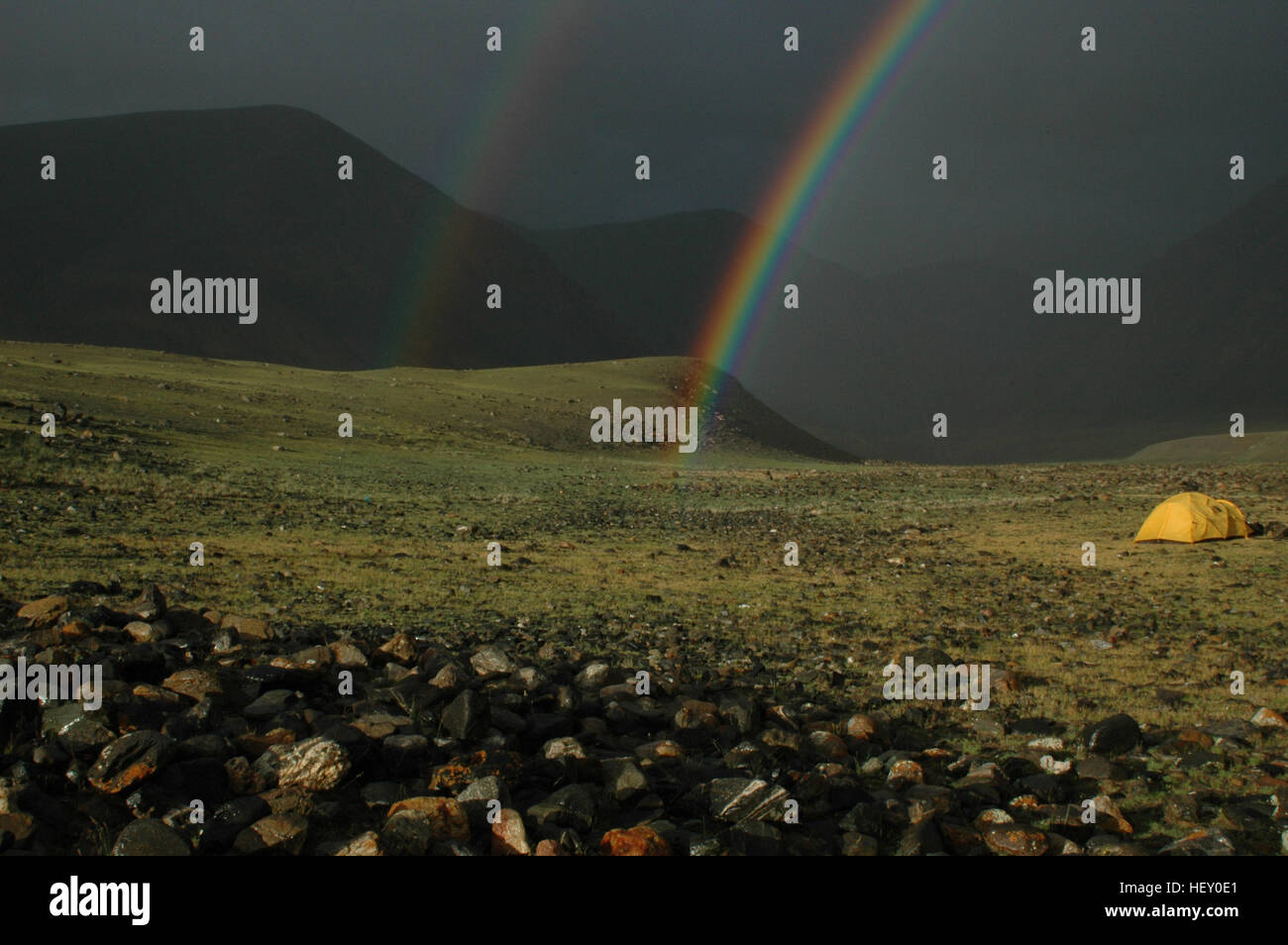 Rainbow framing campsite, Hoh Serh Range, Mongolian Altai, Bayan-Ölgii, Mongolia Stock Photo