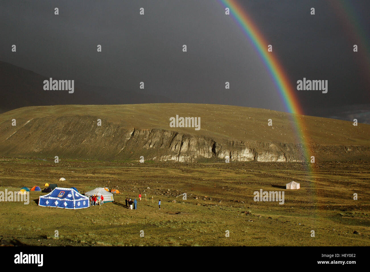 Rainbow framing campsite, Hoh Serh Range, Mongolian Altai, Bayan-Ölgii, Mongolia Stock Photo