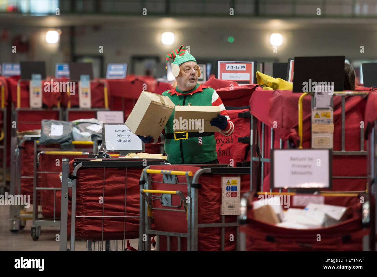 Royal Mail Christmas temp workers process Christmas mail at the Royal Mail Christmas sorting office in Llantrisant, South Wales, UK. Stock Photo