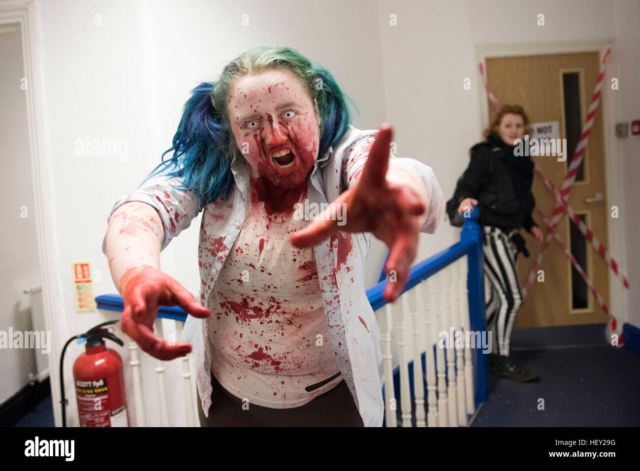 A hospital patient in blood spattered hospital ward during a 2.8 Hours Later zombie game in Cardiff, South Wales. Stock Photo