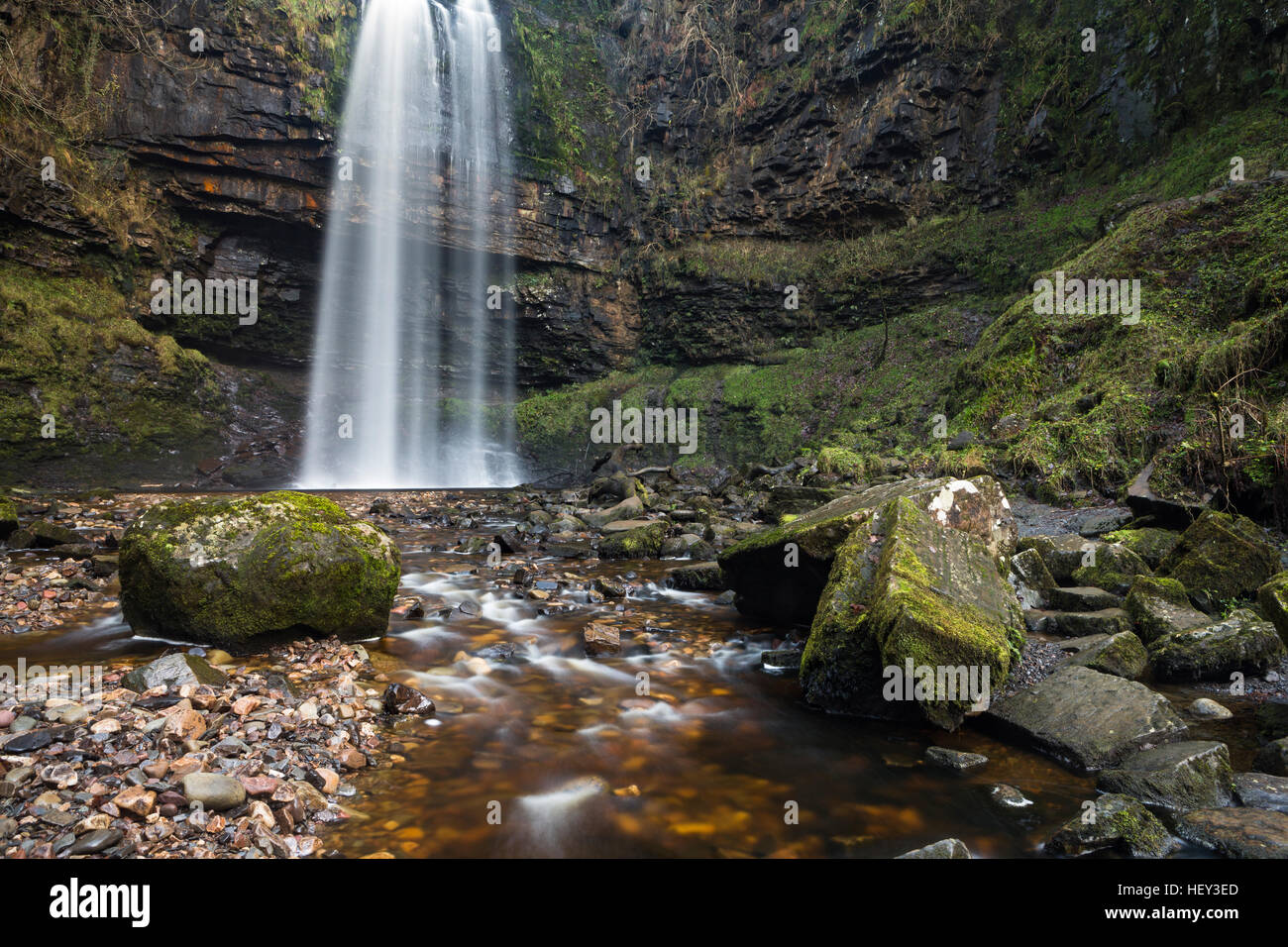 Henrhyd Falls, Sgwd Henrhyd, is the highest waterfall in South Wales. The Nant Llech drops over the hard sandstone known as Farewell Rock. Stock Photo