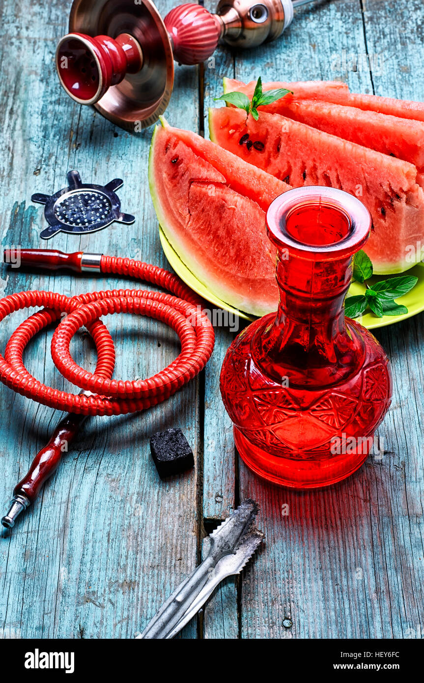 Details Eastern Smoking hookah and diced ripe watermelon Stock Photo
