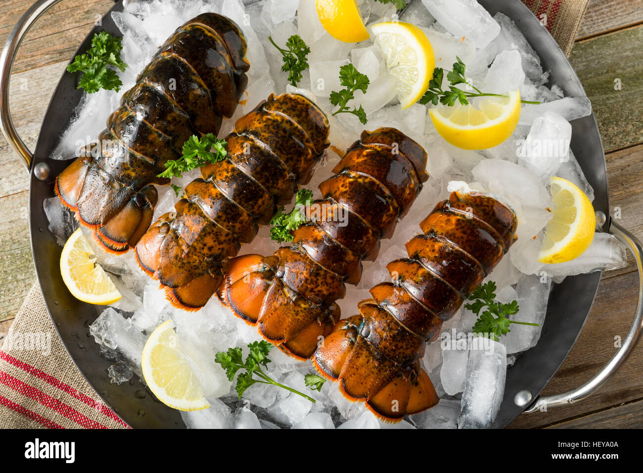 Raw Organic Fresh Lobster Tails with Lemon and Herb Stock Photo Alamy
