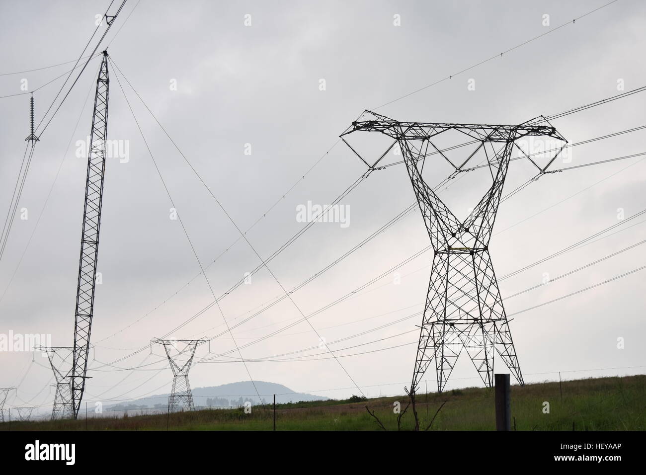 Power lines on a cloudy day Stock Photo - Alamy