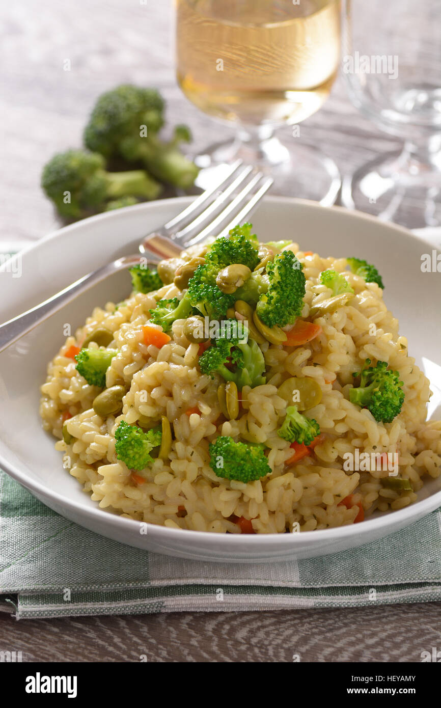risotto with broccoli and broad beans Italian vegetarian recipe Stock