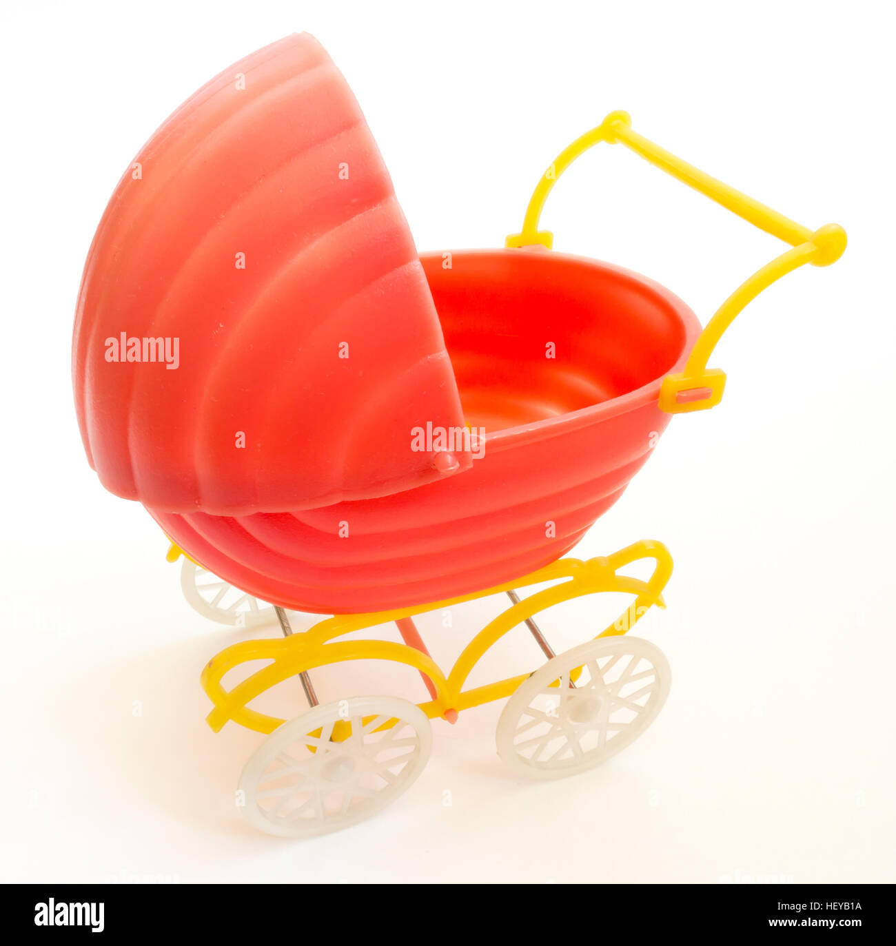 The Miniature toy baby carriage. Stock Photo