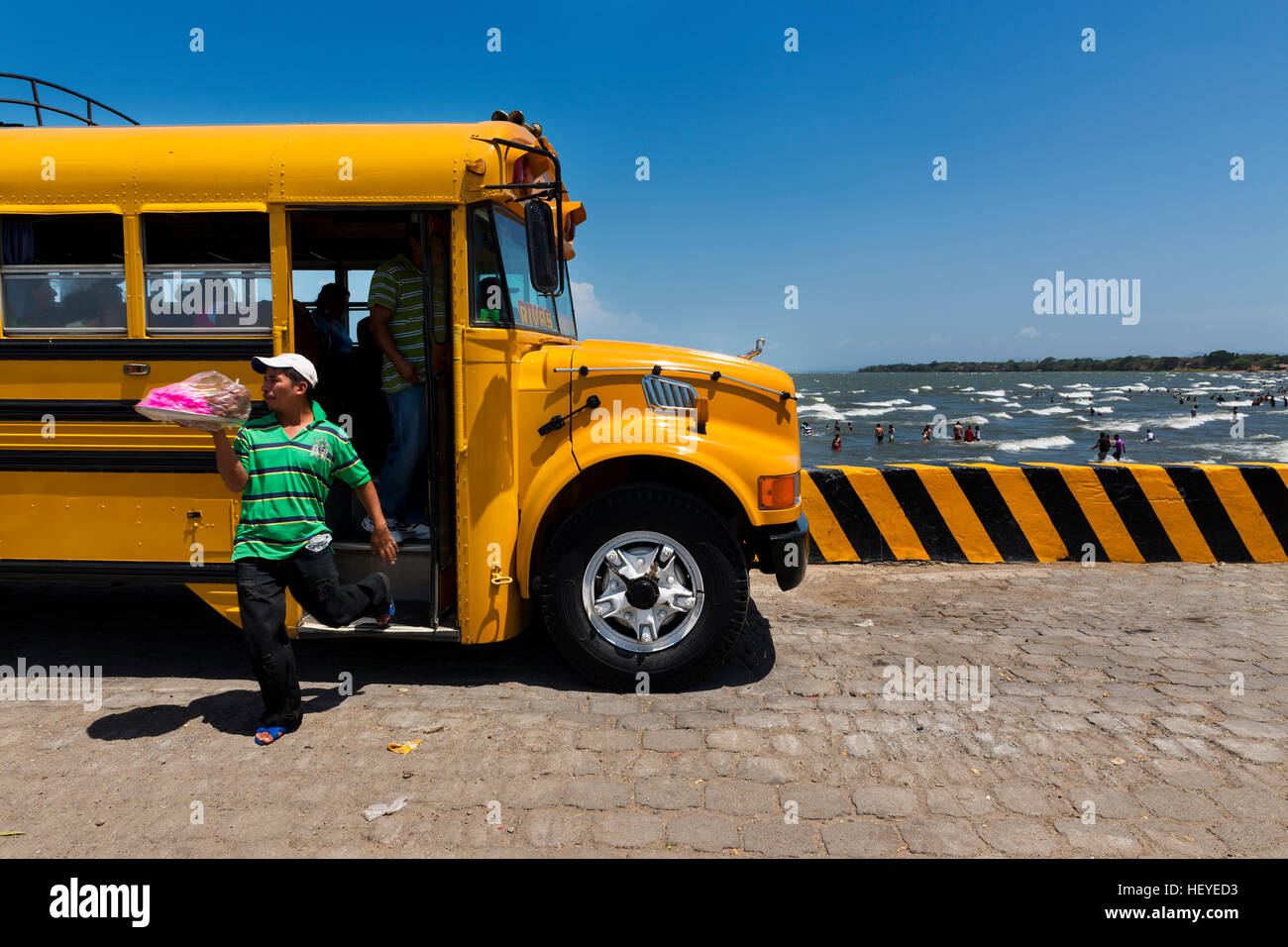 San Jorge, Nicaragua - April 11, 2014: Food vendor leaving a bus in the Ferry Terminal in the town of San Jorge in the shores of the Lake Nicaragua Stock Photo