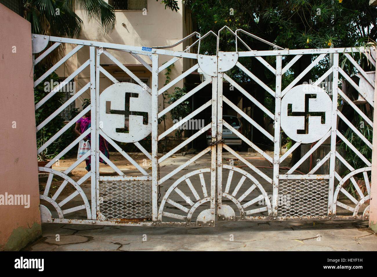 Ornate wrought iron gate with Swastika pattern Stock Photo