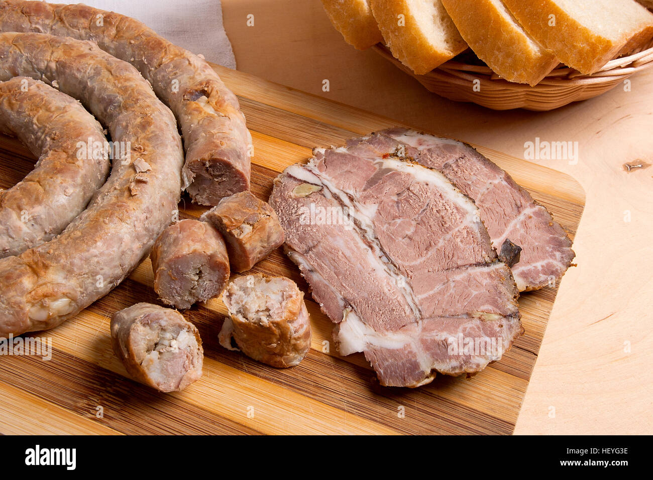 Roasted traditional homemade sausage with spices and herbs and slices