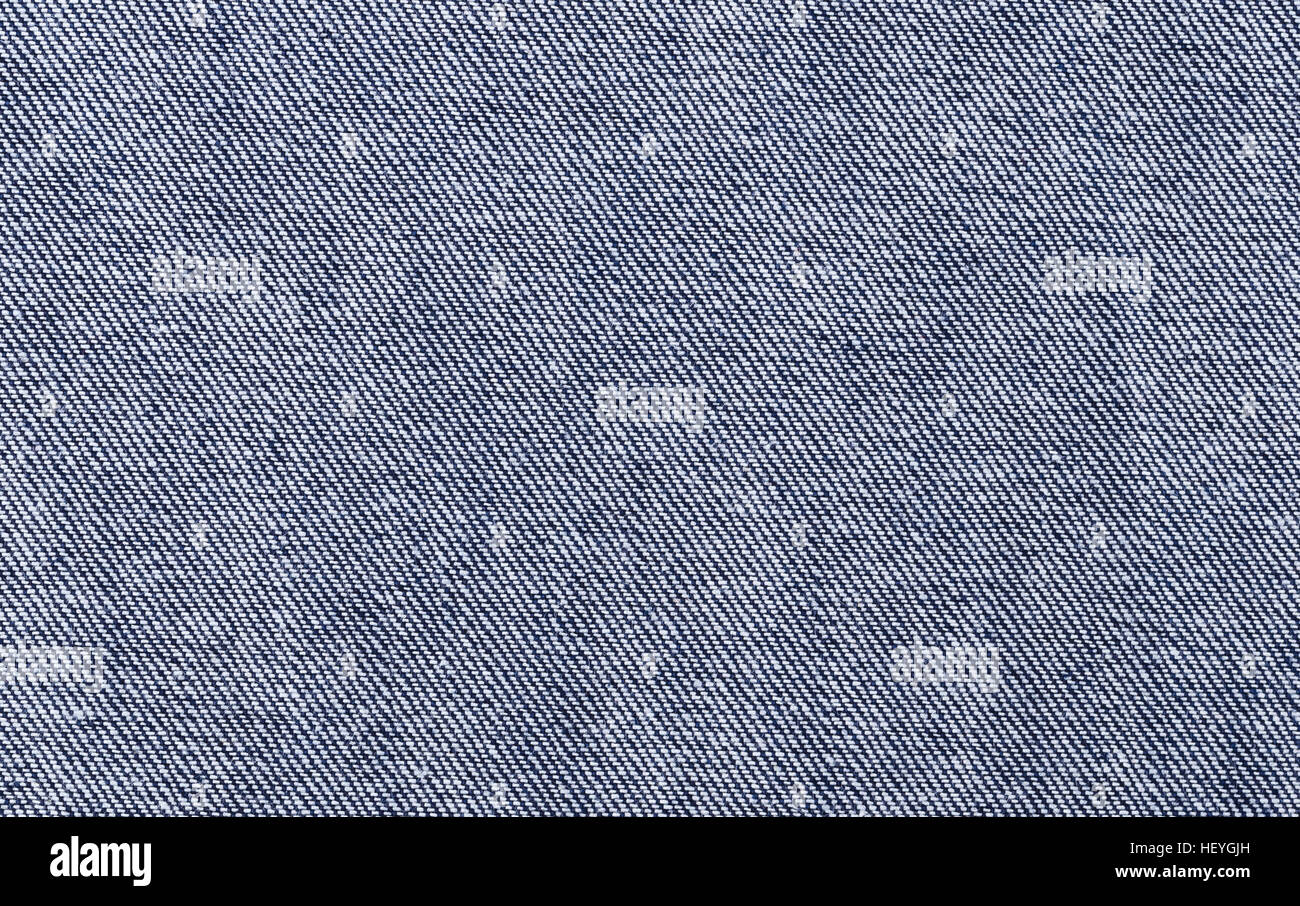 Blue denim textile. Surface of sturdy cotton warp-faced fabric. Stock Photo