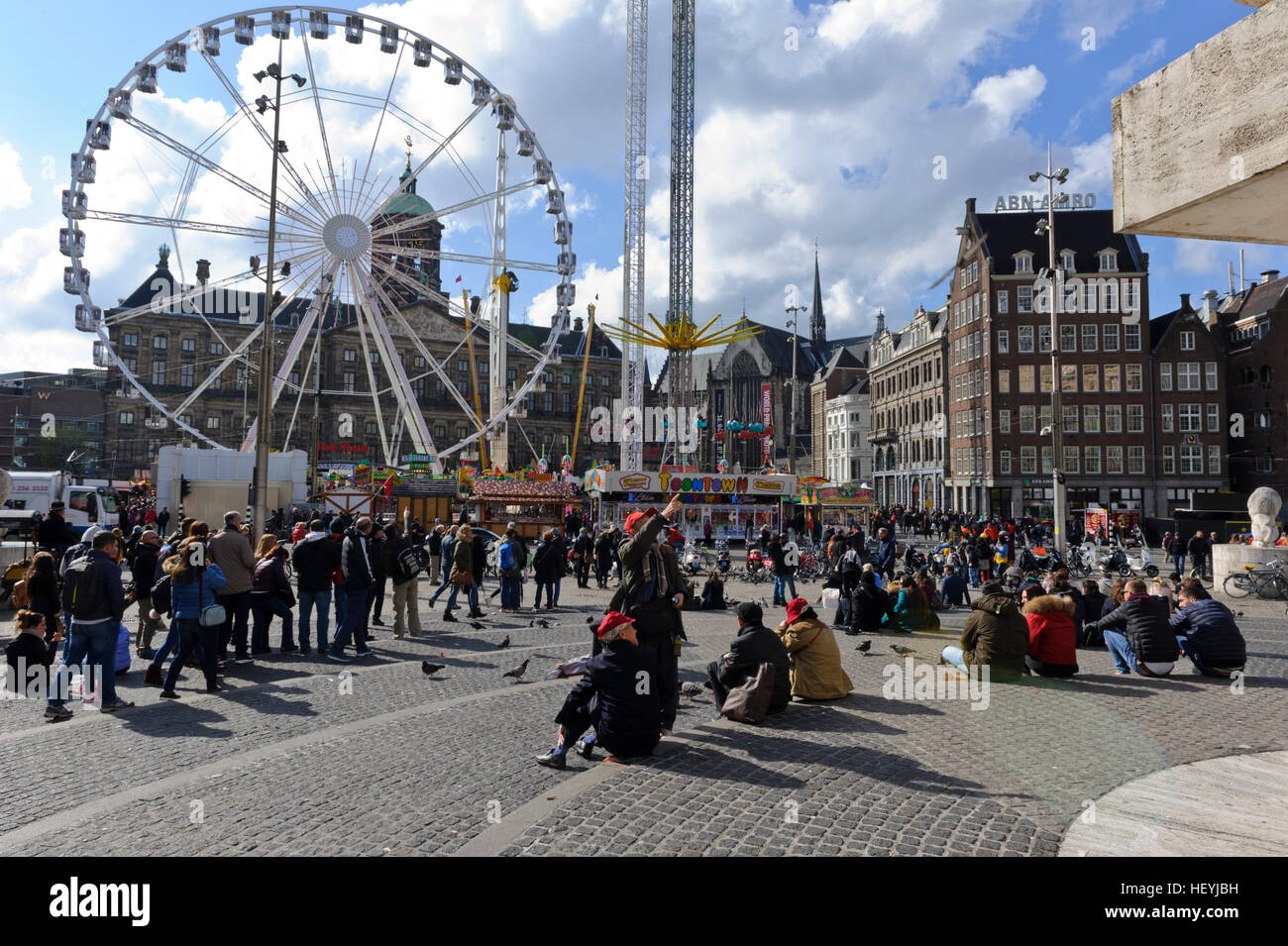 People gathered at a fun fair in Dam Square in Amsterdam, Holland, Netherlands. Stock Photo