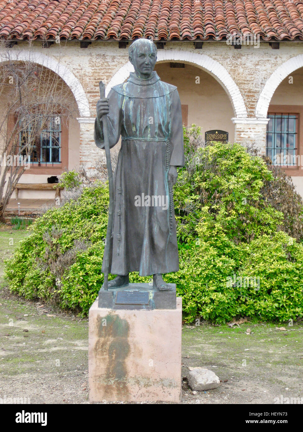Father Junipero Serra statue in front of Mission San Antonio Stock Photo