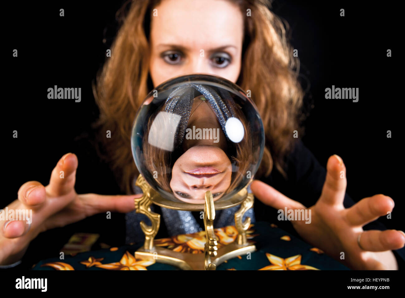 Fortune teller looking into a crystal ball Stock Photo Alamy