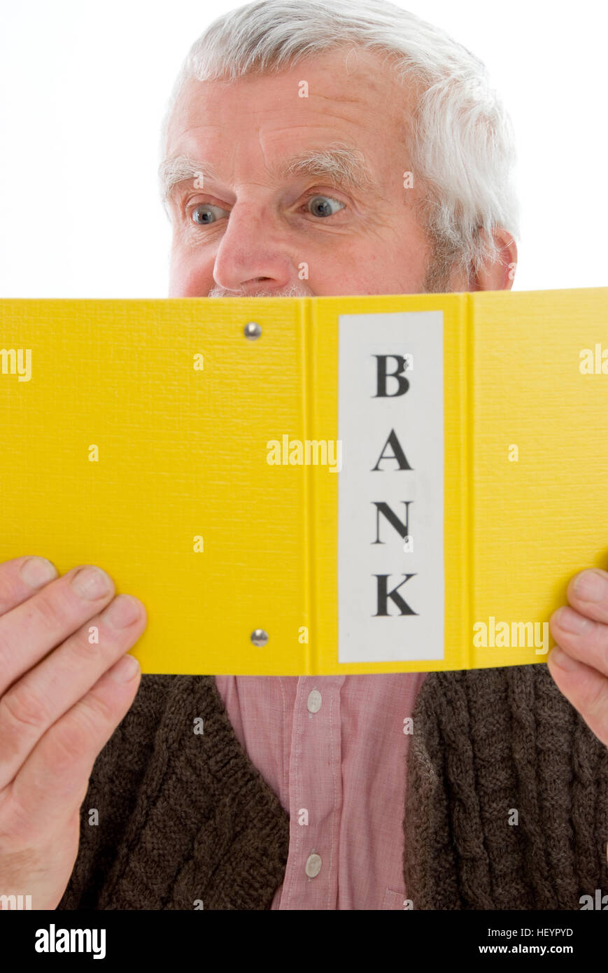 Retiree, senior looking through his bank account transactions, shocked Stock Photo